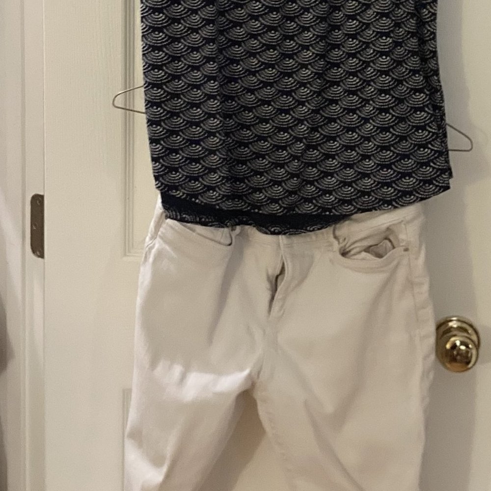 Blue and white shirt, white jeans